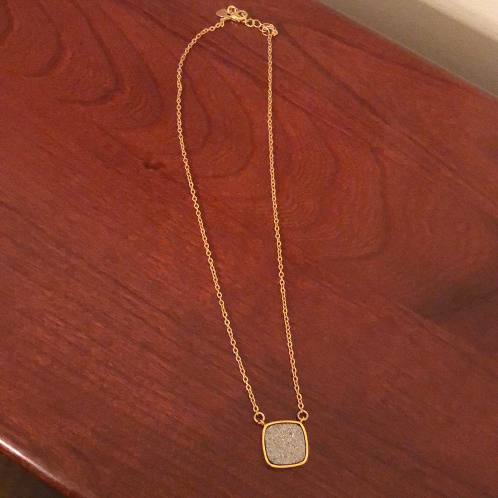 Gold necklace with sparkly stone